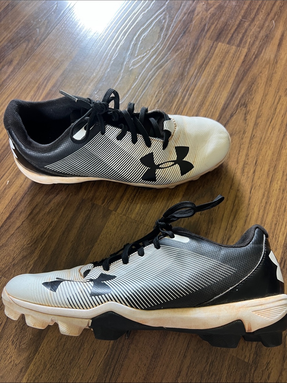 Under Armour Black and White Baseball Cleats with Gradient Stripes